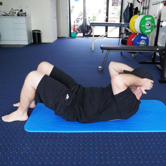 Photo of a stomach crunch exercise