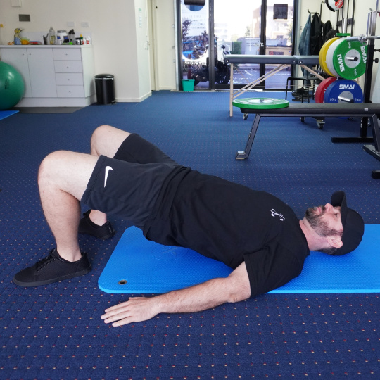 Photo of a glute bridge exercise.